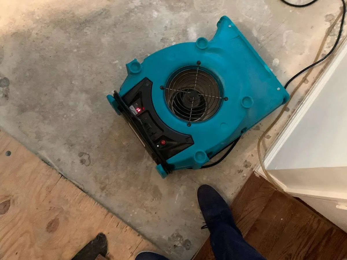 Air mover drying subfloor during Leak Detection & Repair in Somers